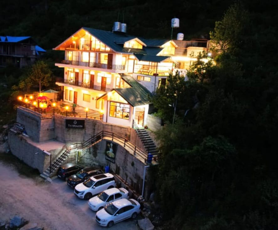 Trimounts hotel illuminated at night