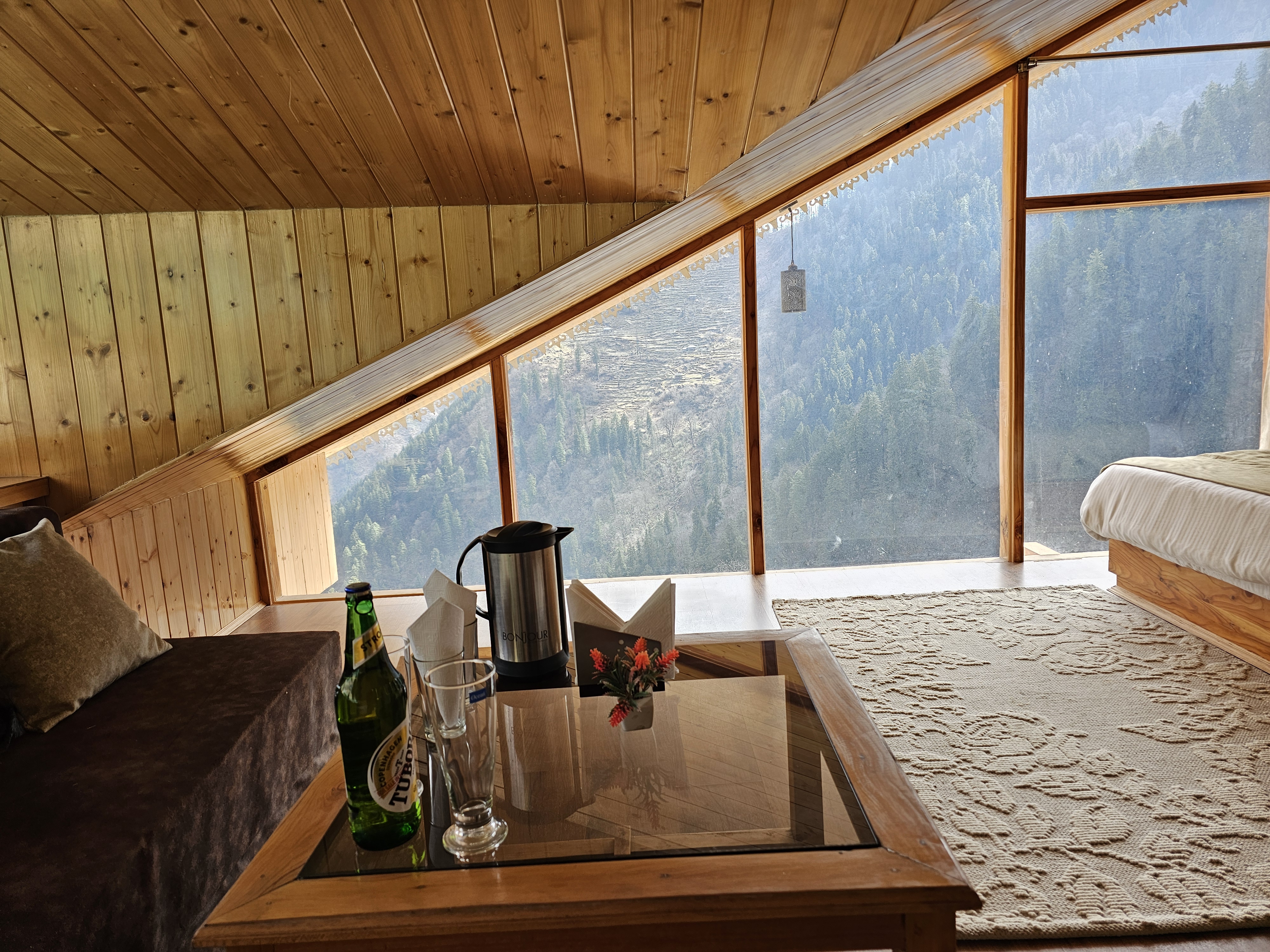 Reading nook with coffee table by the panoramic attic window