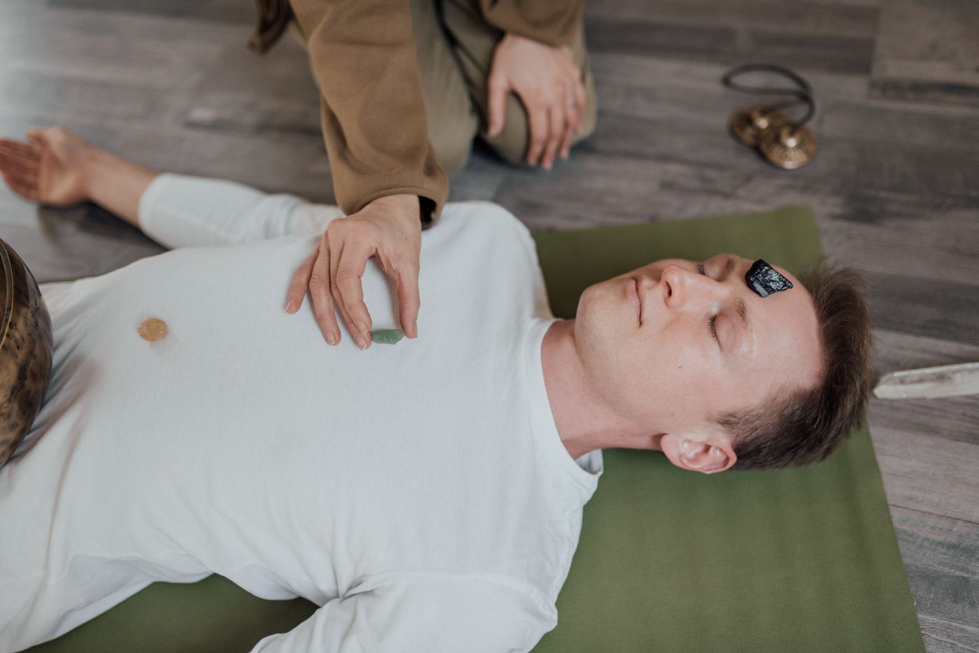 Chakra balancing — crystals placed on energy points during a healing session at Trimounts